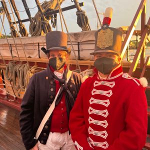 Two people wearing traditionally british sailer outfits