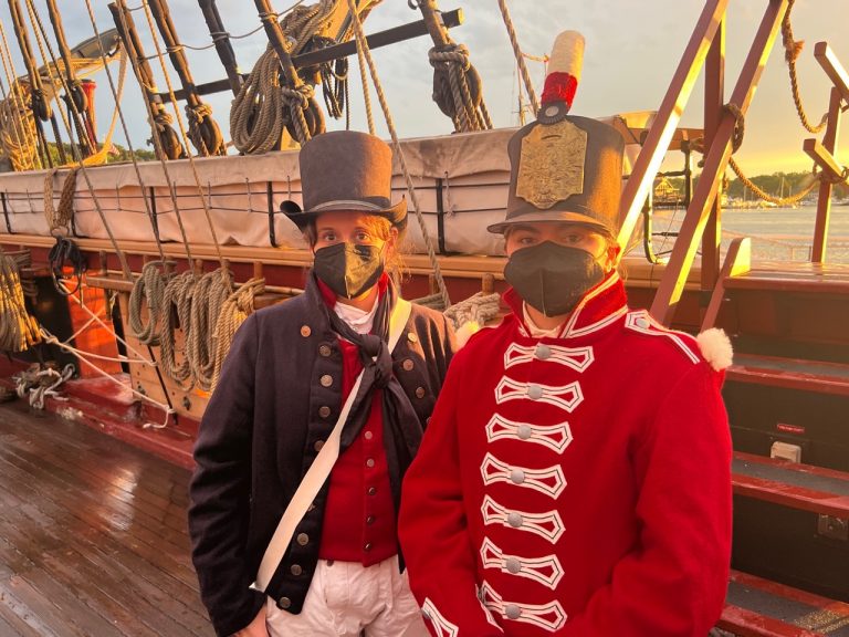 Two people wearing traditionally british sailer outfits