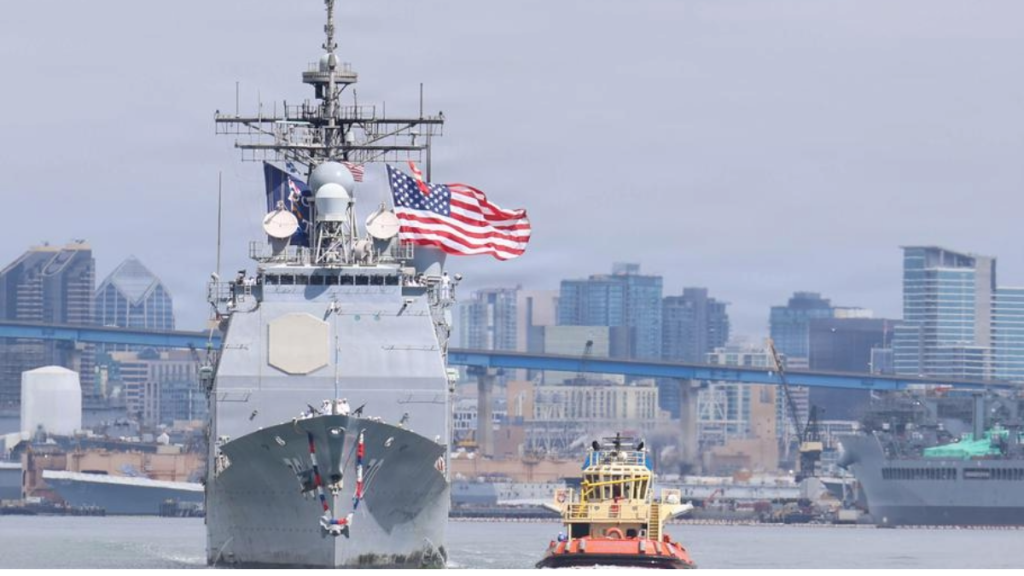 USS Lake Erie (CG-70) returns to Naval Base San Diego on June 27, 2026, flying the American flag after 11 months of operations at sea. Photo credit: Aaron Sandoval Mendoza/U.S. Navy